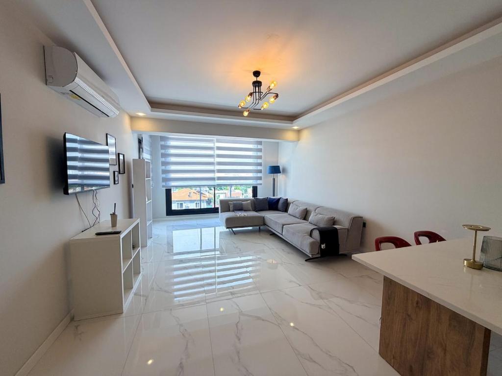 a living room with a couch and a table at Dalaman Airport Suite 11 in Dalaman