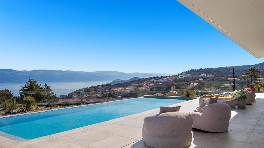 a villa with a swimming pool with a view at Villa Sun dance by Villas Guide in Vrbnik