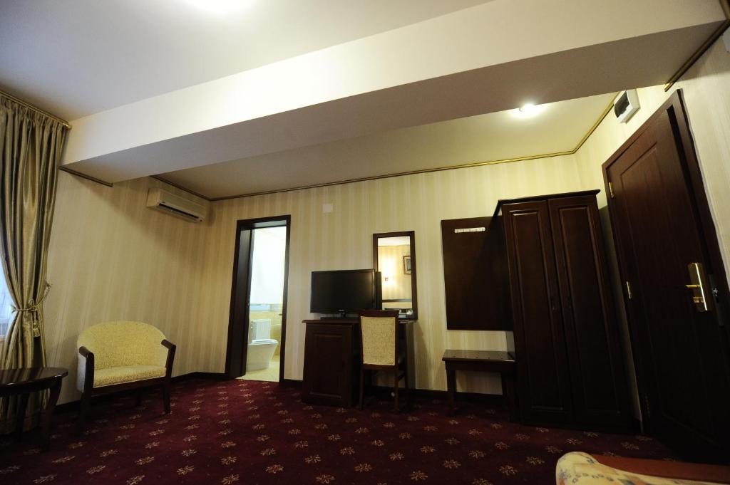 TV a/nebo společenská místnost v ubytování Hotel Mondial - Baia