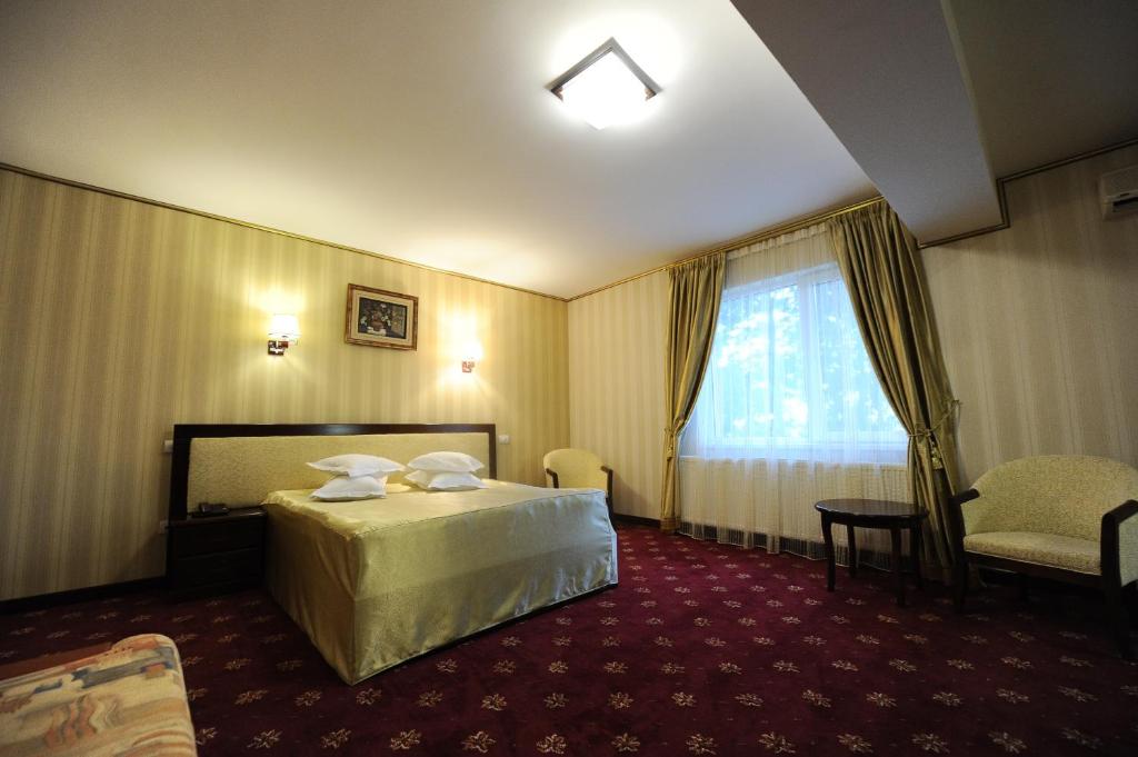 Postel nebo postele na pokoji v ubytování Hotel Mondial - Baia