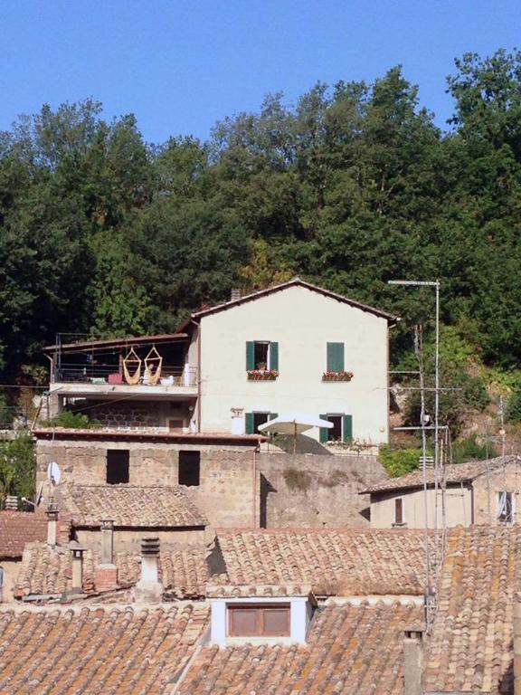 a large white house on a hill with roofs at Casa Belvedere in Mazzano Romano