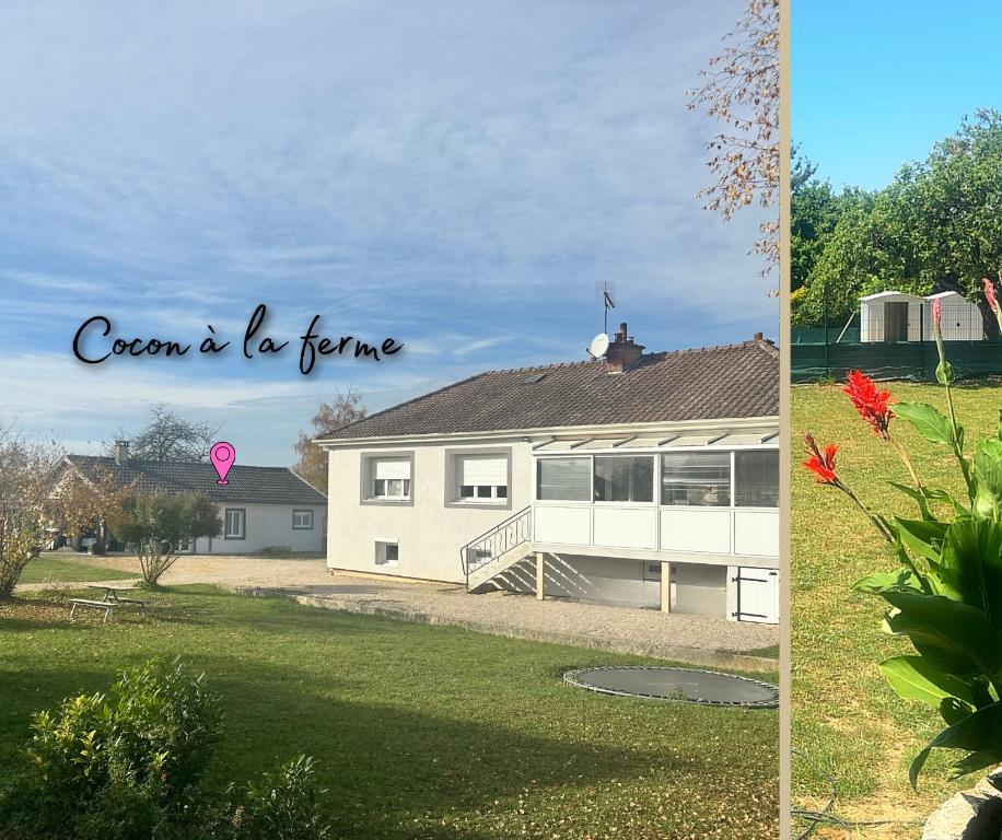 a white house with a roof and a yard at Cocon à la ferme - Lac du Der in Loisy-sur-Marne