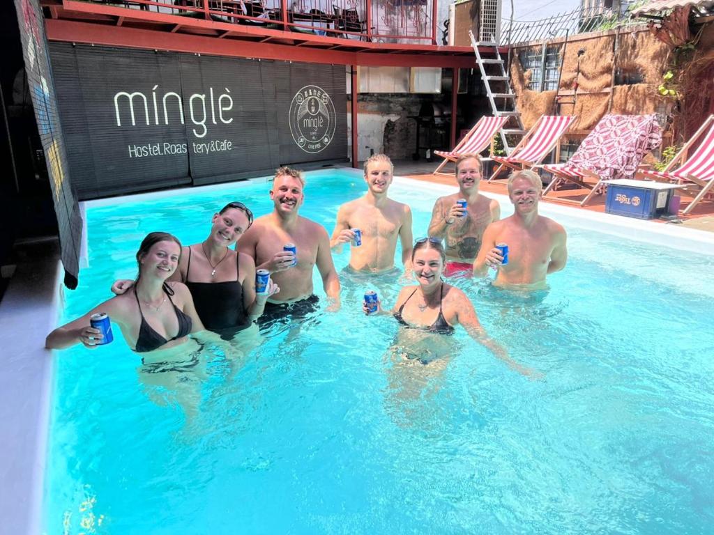 a group of people are in a swimming pool at Mingle Lekiu in Kuala Lumpur