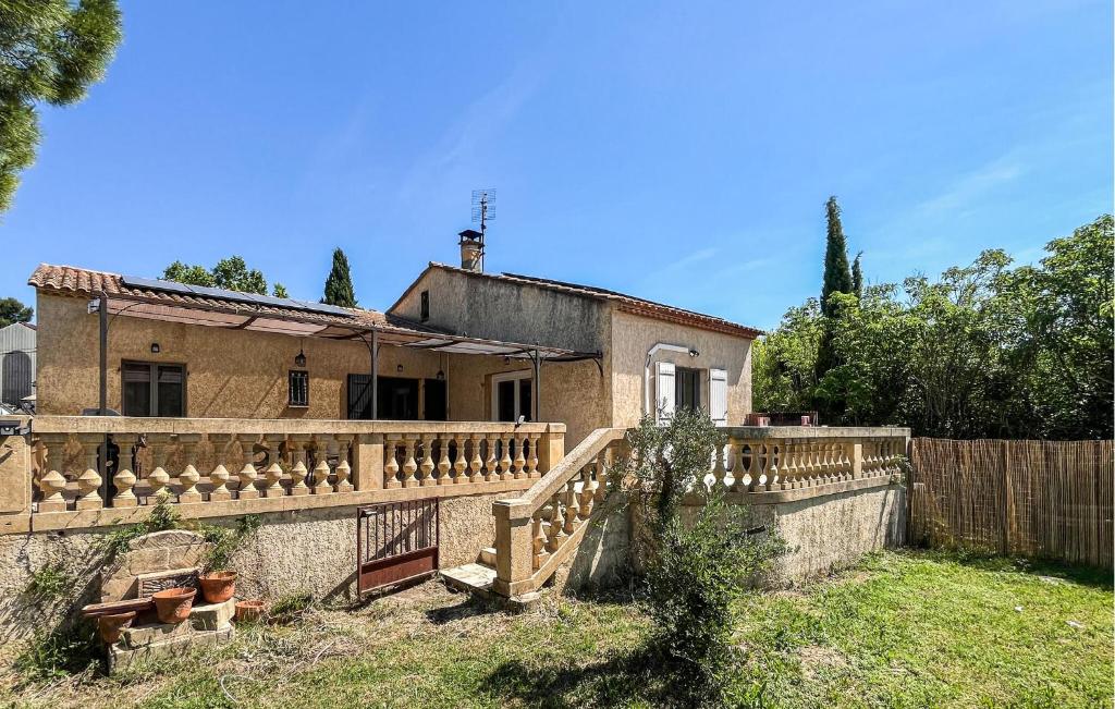 a house with a fence in front of it at Maison Proche Uzès in Vers Pont du Gard