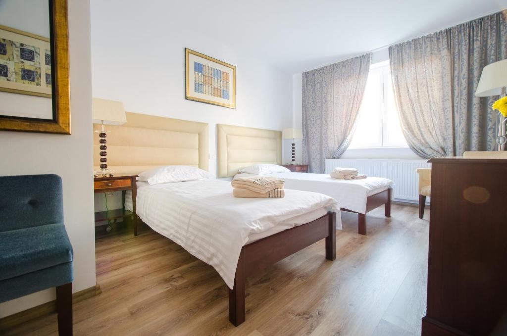 Postel nebo postele na pokoji v ubytování Hotel EKA