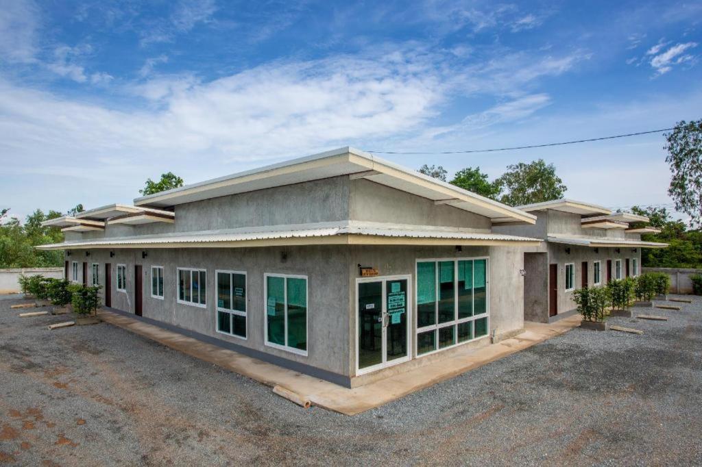 a large building with a lot of windows at Sun Resort in Sa Kaeo