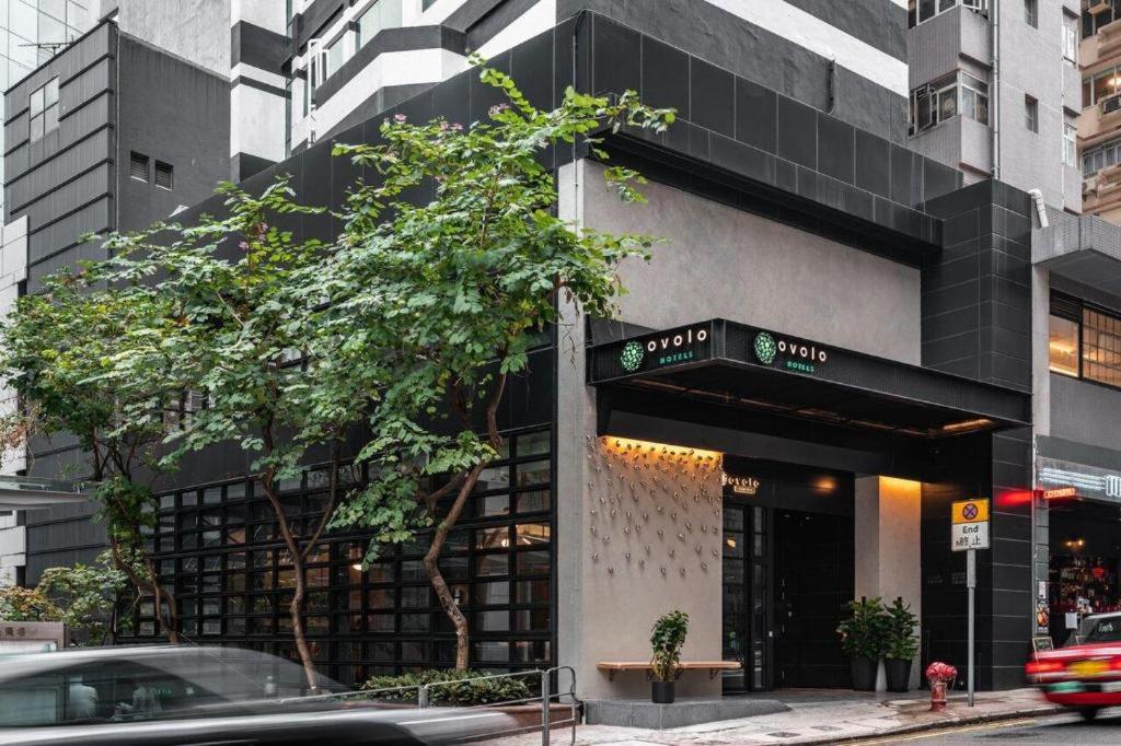 a building with a sign on the front of it at Ovolo Central in Hong Kong