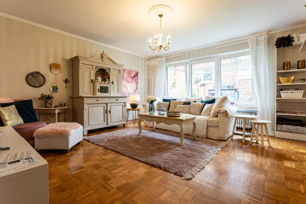 a living room with a couch and a table at Ferienwohnungen Lemma in Möhnesee