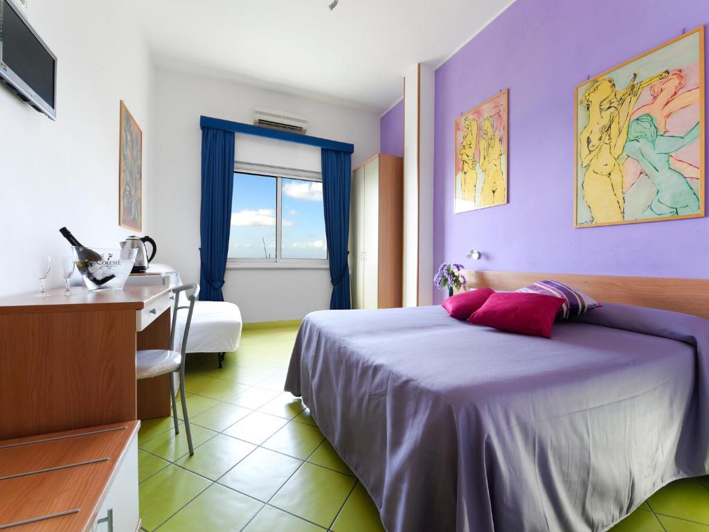 Postel nebo postele na pokoji v ubytování Alta Marea Sorrento