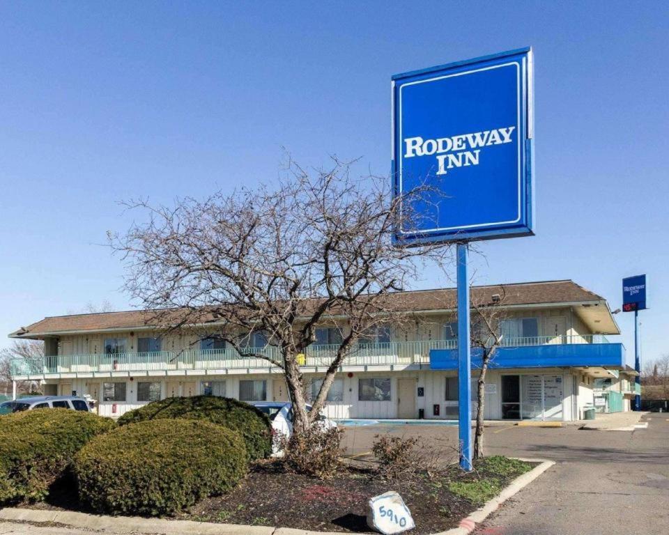a blue sign in front of a building at Loyalty Inn in Brice