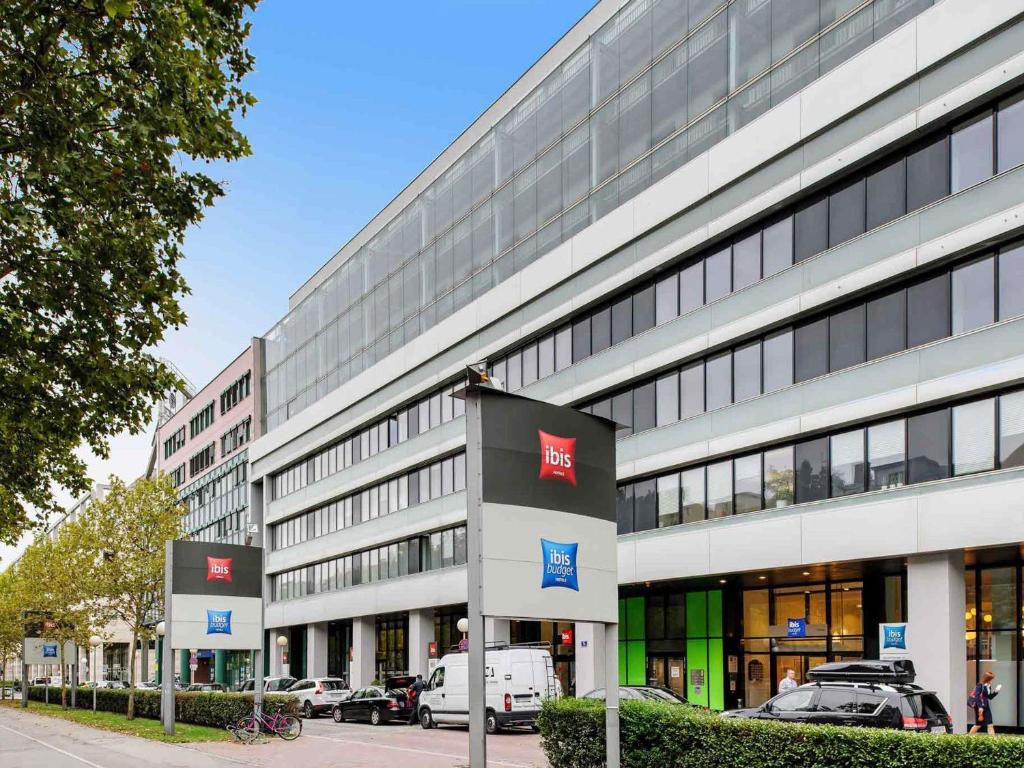 a large building with a sign in front of it at Ibis budget Wien Messe in Vienna