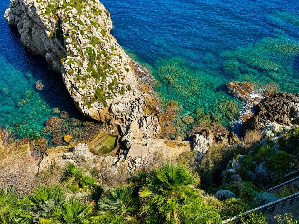 an aerial view of the ocean and a rocky coastline at AWA Kafara in Porticello