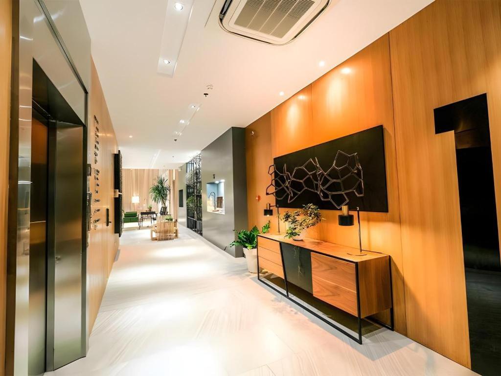 a hallway of an office building with a desk at Avior Hotel in General Santos