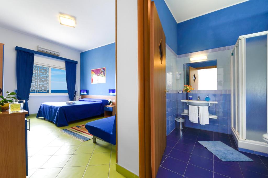 Postel nebo postele na pokoji v ubytování Alta Marea Sorrento