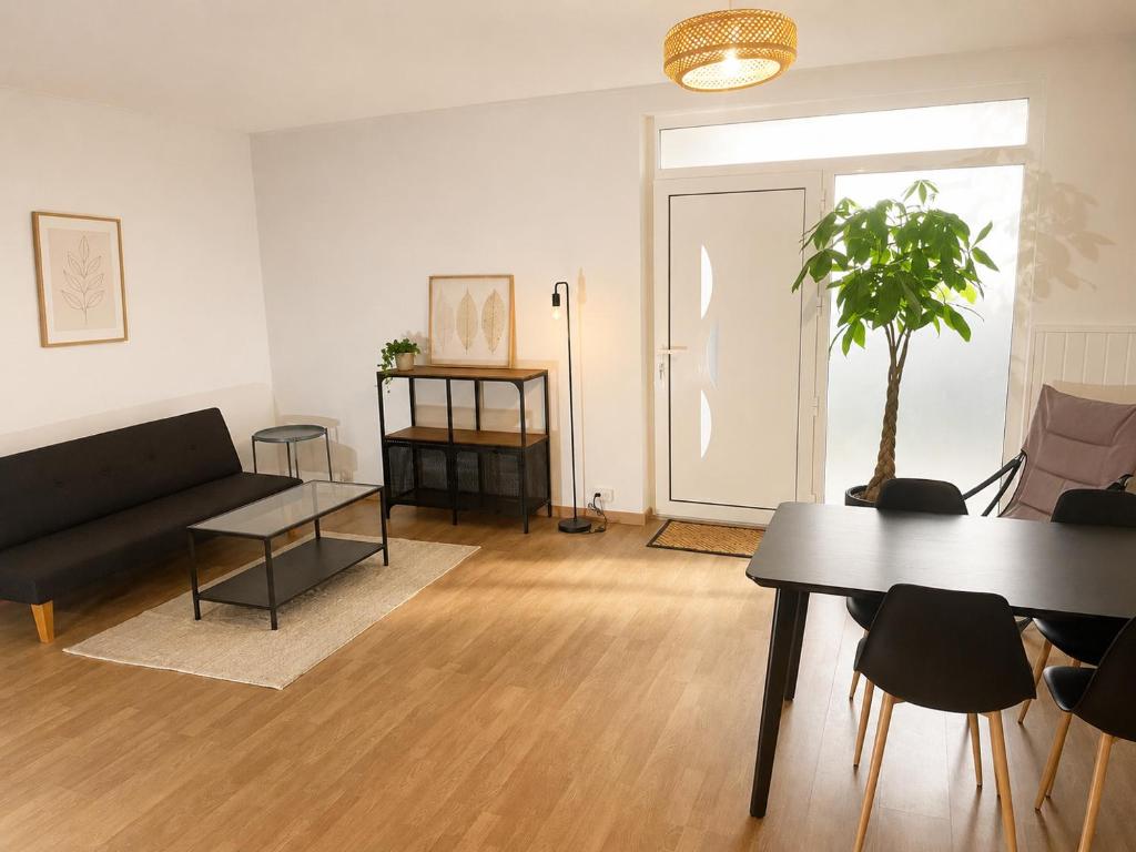 a living room with a couch and a table at Independent 2-room apartment in Senhora da Hora