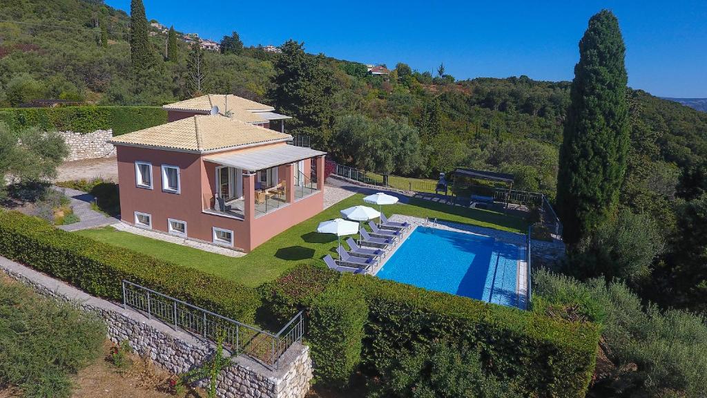 an aerial view of a house with a swimming pool at EOS Luxury Villa in Nydri