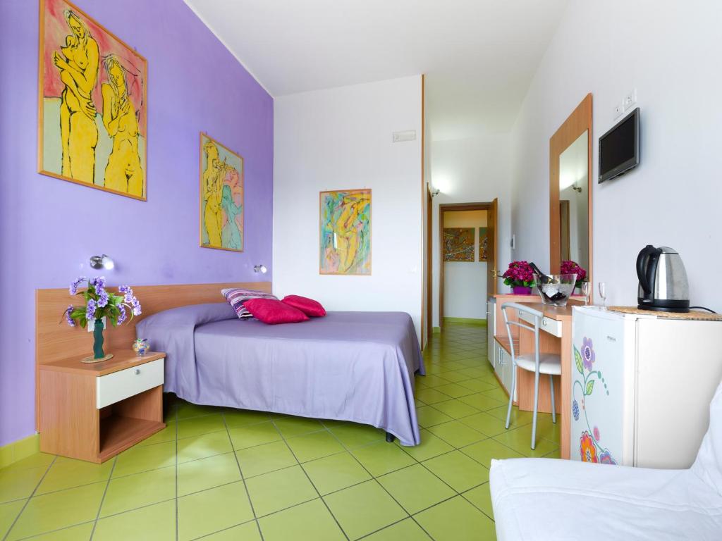 Postel nebo postele na pokoji v ubytování Alta Marea Sorrento
