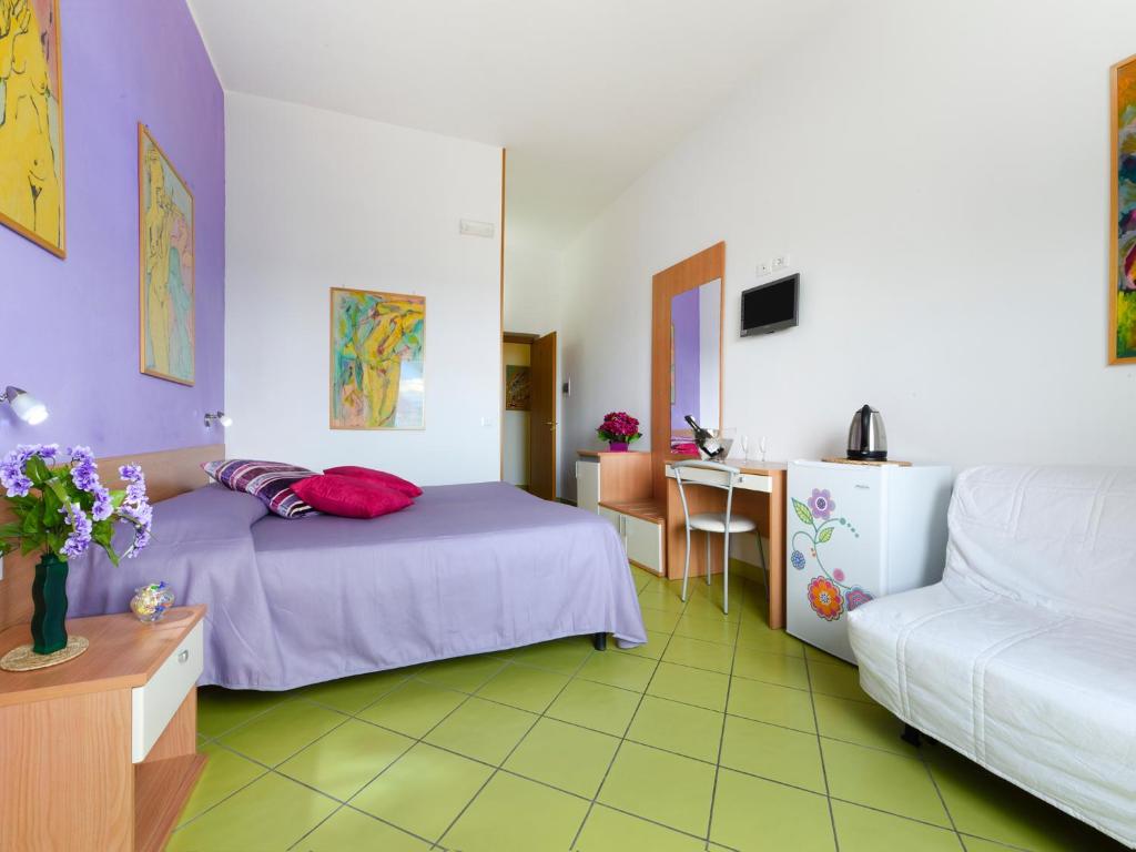 Postel nebo postele na pokoji v ubytování Alta Marea Sorrento