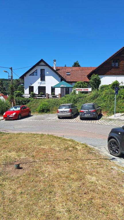 a group of cars parked in a parking lot at Pension Egida in Řež