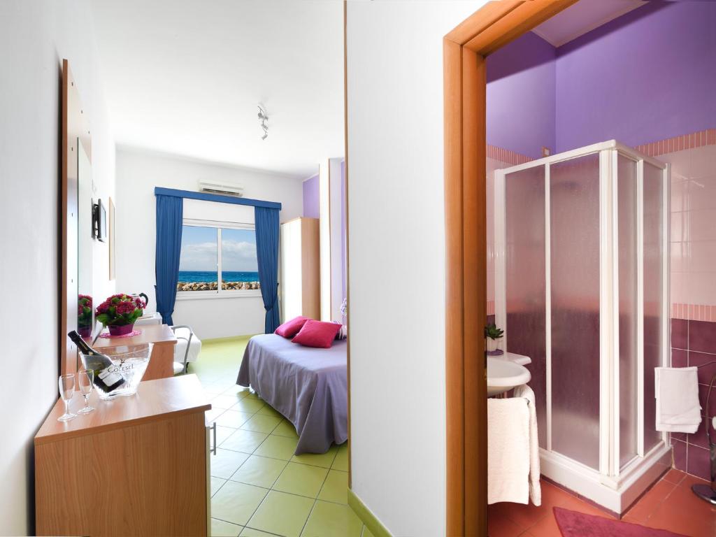Postel nebo postele na pokoji v ubytování Alta Marea Sorrento