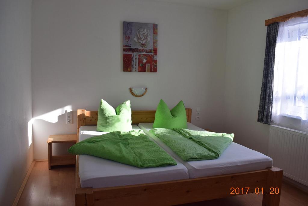Postel nebo postele na pokoji v ubytování U Oslíka
