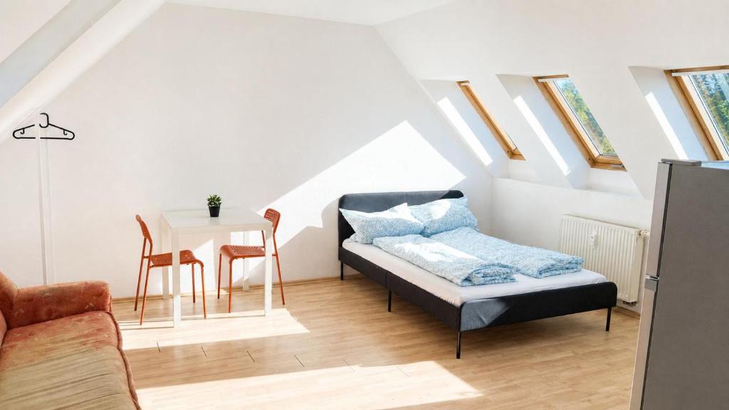 a living room with a couch and a table at Urban Worker Flat in Kirchberg