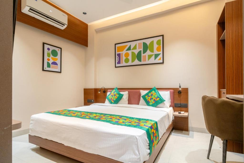 a bedroom with a large bed in a room at Treebo Hub in Indore