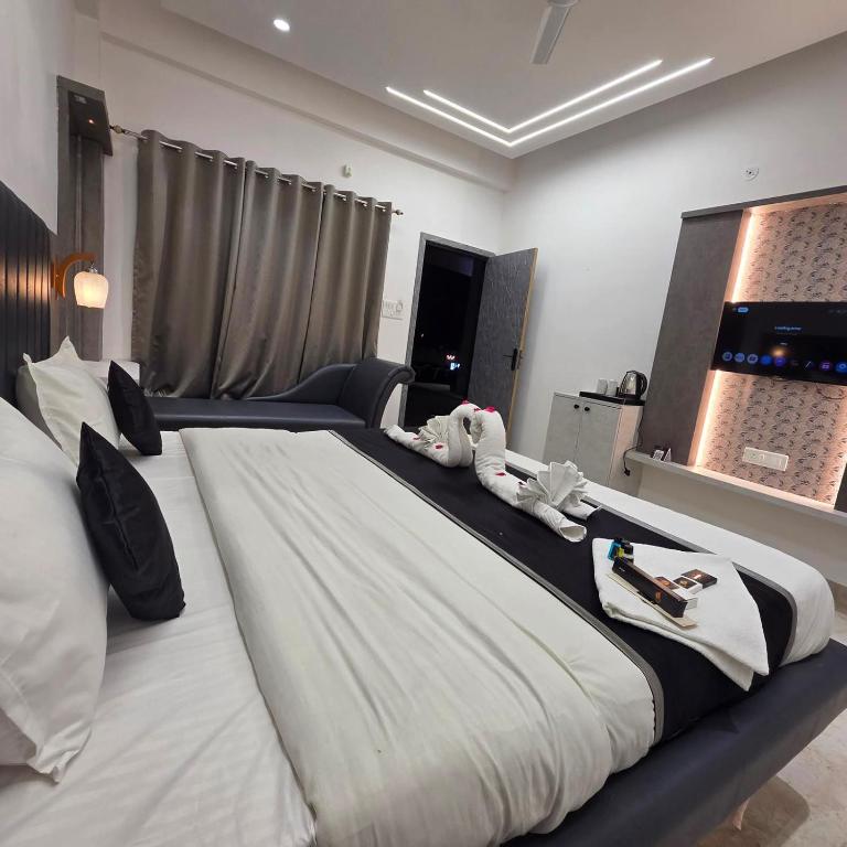 a bedroom with a large bed with animals on it at The Whispering Palms Resort in Bhopal