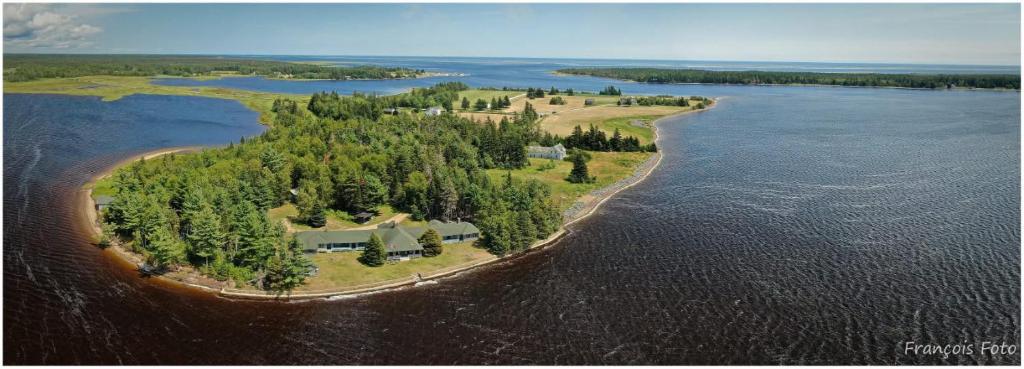 an island in the middle of a body of water at Wishart Point Lodge in Neguac
