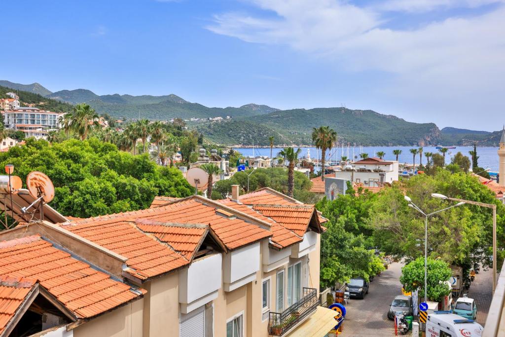 a view of a city with houses and a street at Yaz Apart Hotel in Kaş