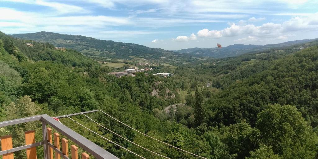 a view of a valley from a suspension bridge at I Ponti in Fanano