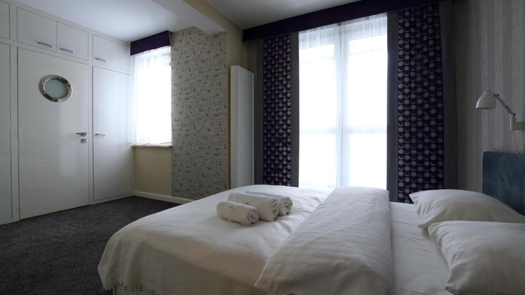 Posteľ alebo postele v izbe v ubytovaní Senator Warsaw Apartments