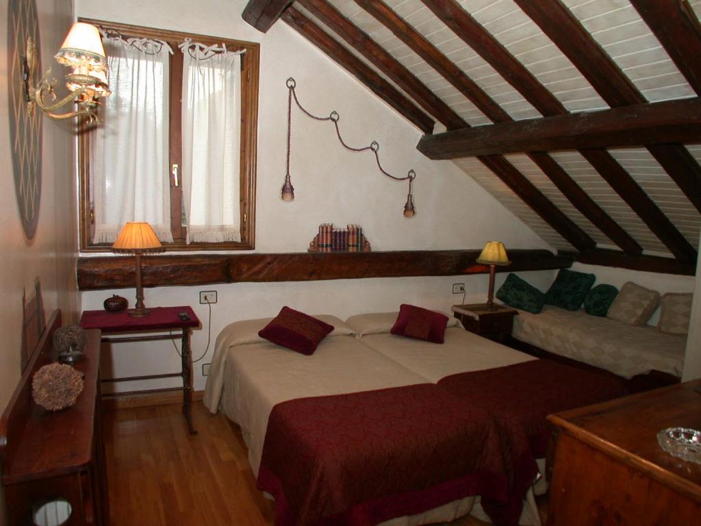 Postel nebo postele na pokoji v ubytování Hotel Casa Frauca