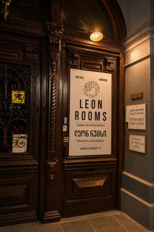 a sign on the side of a door in a building at Leon Rooms in Tbilisi City