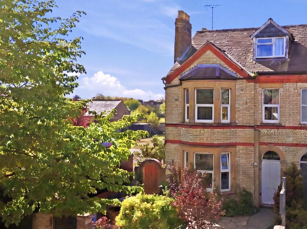 a brick house with a chimney on top of it at The Forest- Greenwood in Cambridge