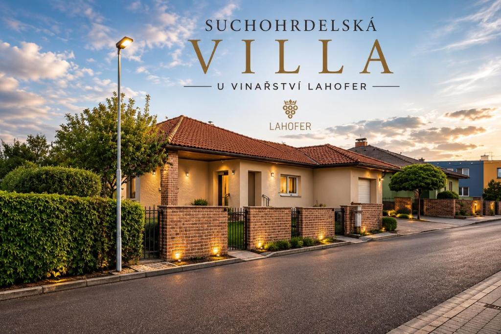a house on a street with a sign that reads villa at Suchohrdelská VILLA u vinařství LAHOFER - RD NOVOSTAVBA v Suchohrdly u Znojma - 2 - 10 osob, 2 apartments in Suchohrdly