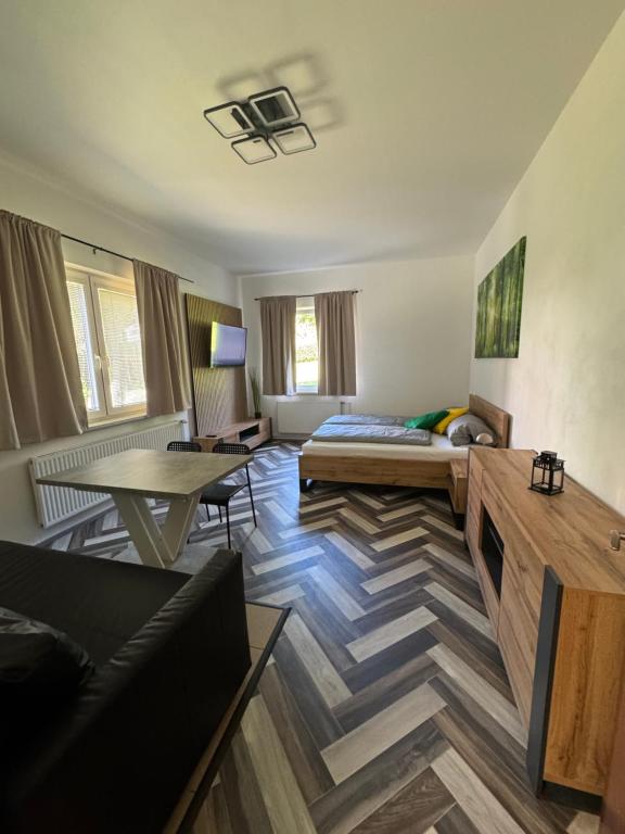 a living room with a couch and a table at Apartmány Veronika - Blansko in Blansko