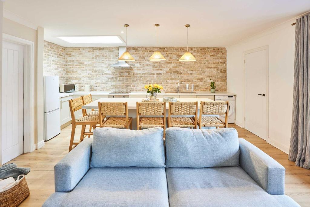 a living room with a couch and a table at Host & Stay - Puffin Cove in Seahouses