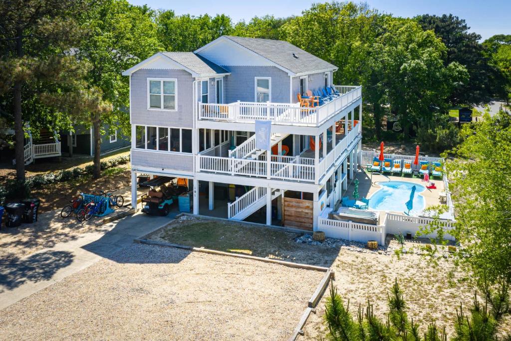 an aerial view of a house with a playground at Pool & Spa Game Rm Walking Distance to Beach & Shops in Duck