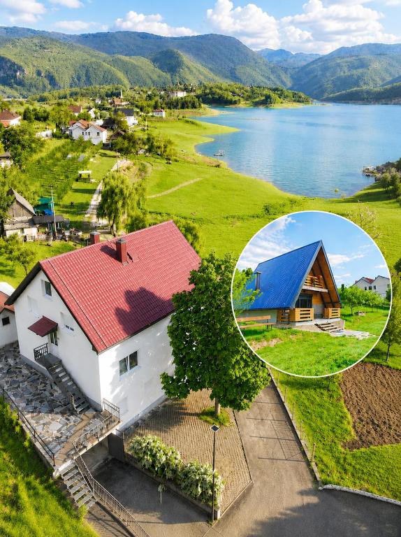 an aerial view of a house and a lake at Apartment & Cottage - Tune in Ripci