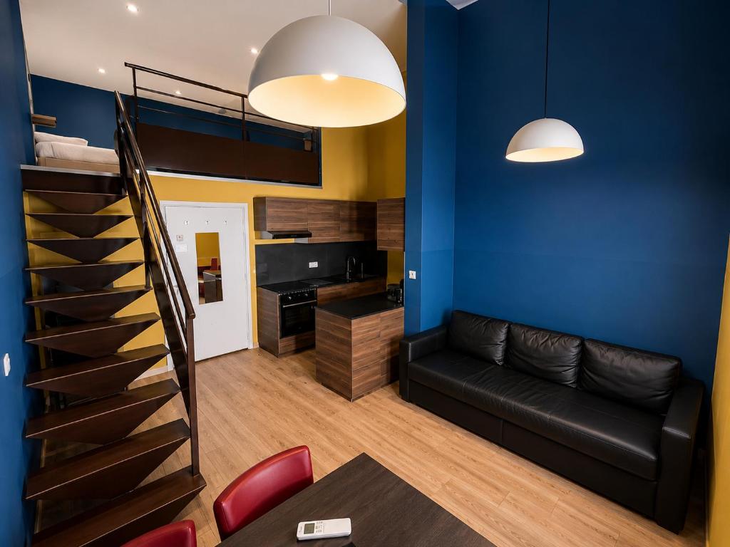 a living room with a couch and a bunk bed at Les Appartements Carré d'or - Nice Centre in Nice