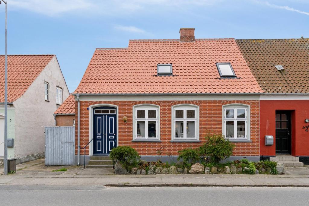 a red brick house with an orange roof at Cozy Holiday Home In Marstal On Ærø in Marstal