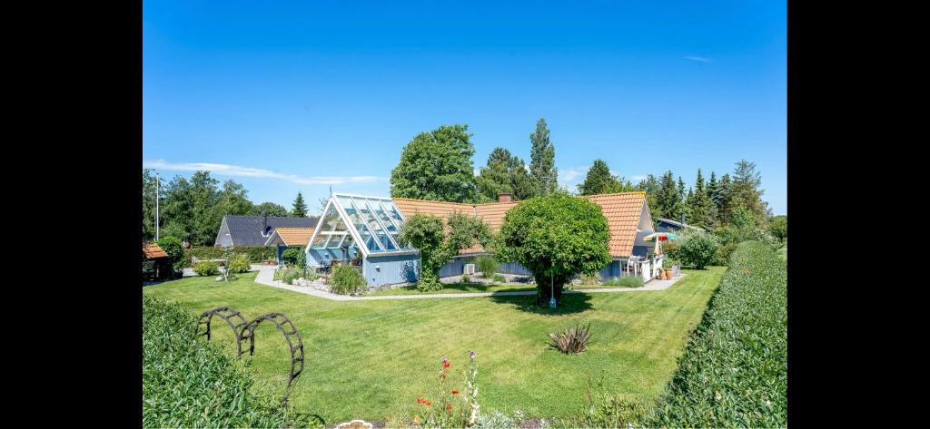 an aerial view of a house with a yard at Cozy Holiday Home With Character in Nakskov