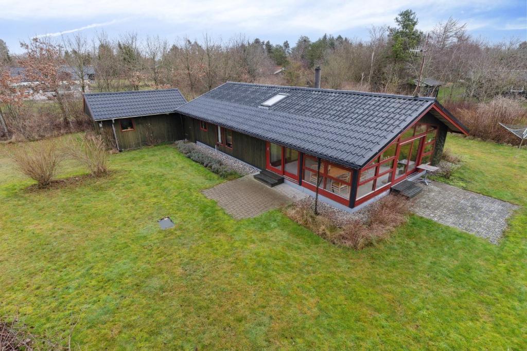 an overhead view of a home with a solar roof at Cozy Summer House In Trend in Løgstør