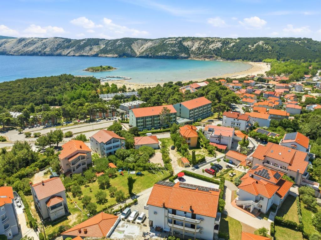 an aerial view of a town with a beach at Guesthouse Marija II in Lopar