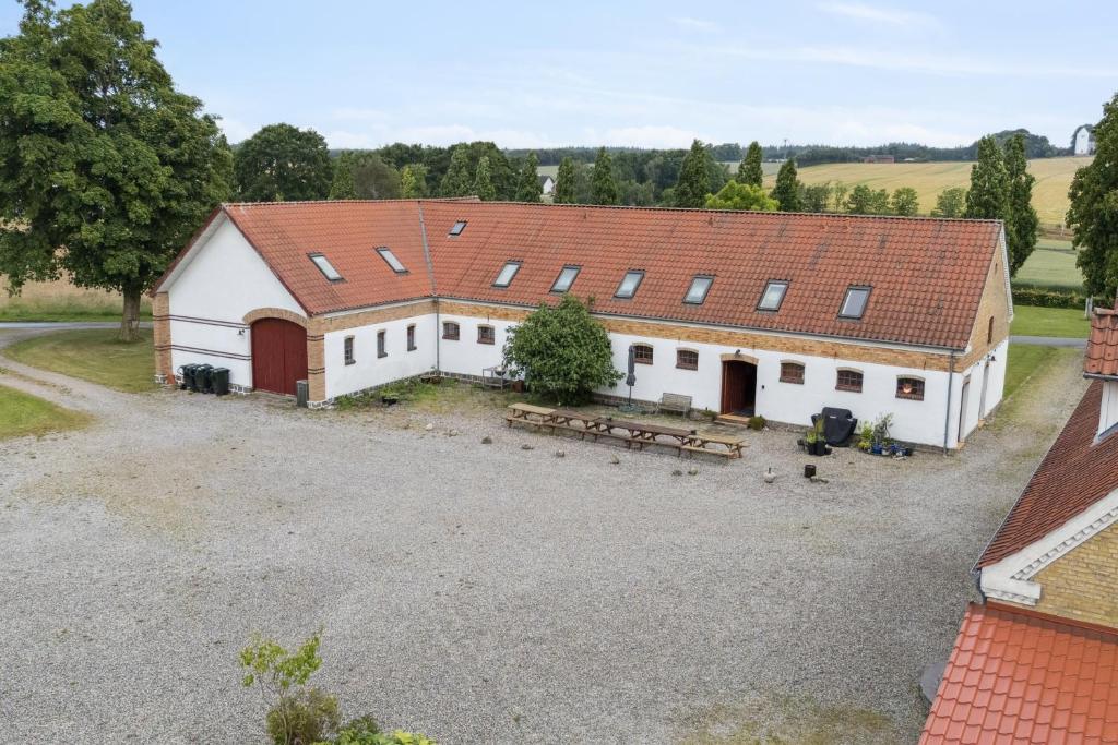 an aerial view of a large white barn at Margretehøj Manor In Scenic Surroundings in Grenå