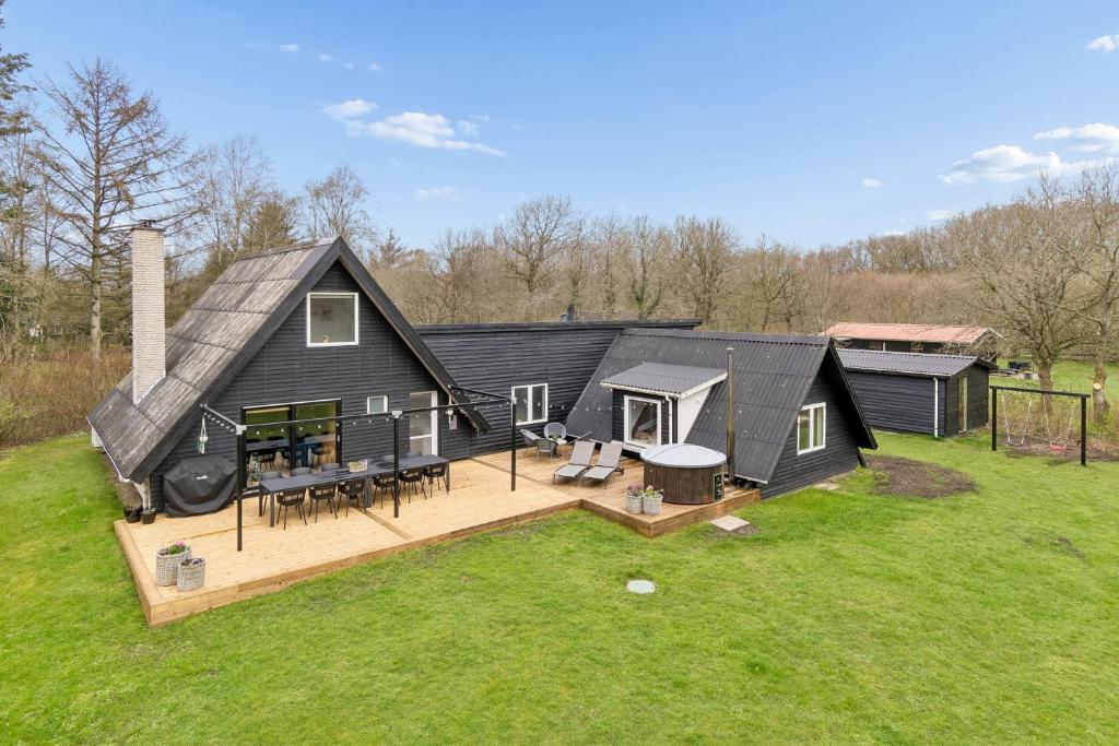 an aerial view of a house with a deck at Holiday Home With Spa Sauna And Hot Tub in Farsø