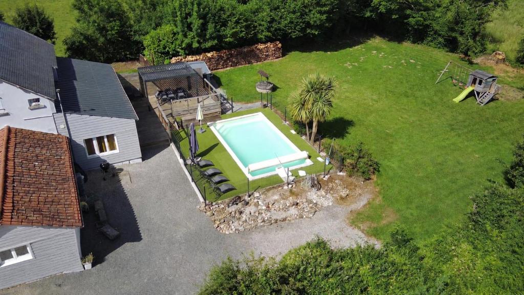 an aerial view of a house with a swimming pool at La maison Callinora in La Chapelle-Saint-Étienne