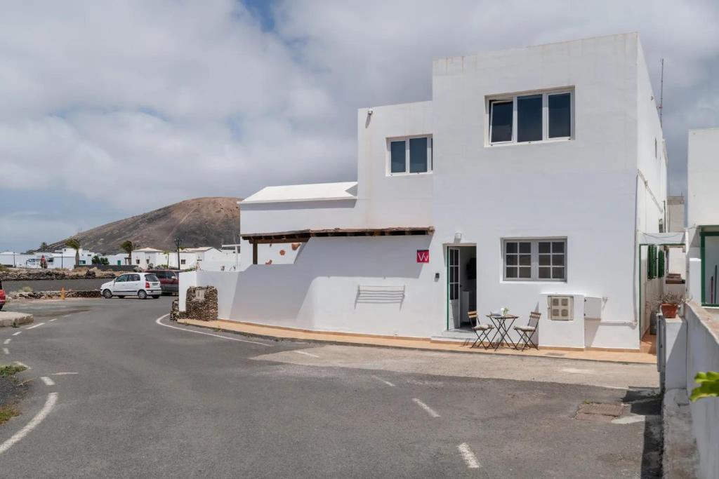 a white building on the side of a street at Uga La Dehesa I in Uga