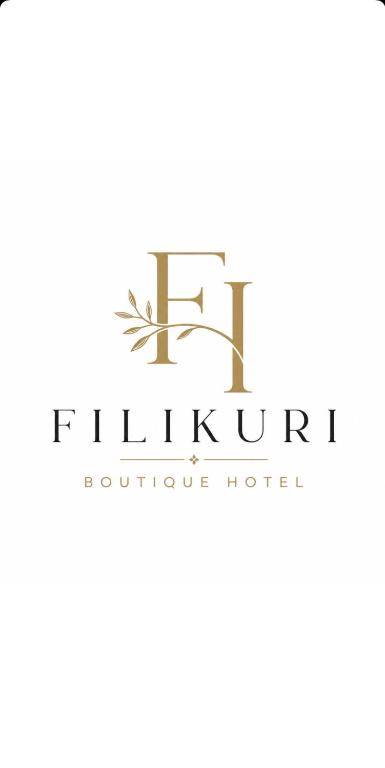 a logo for a furniture store at Filikuri Boutique Hotel in Himare